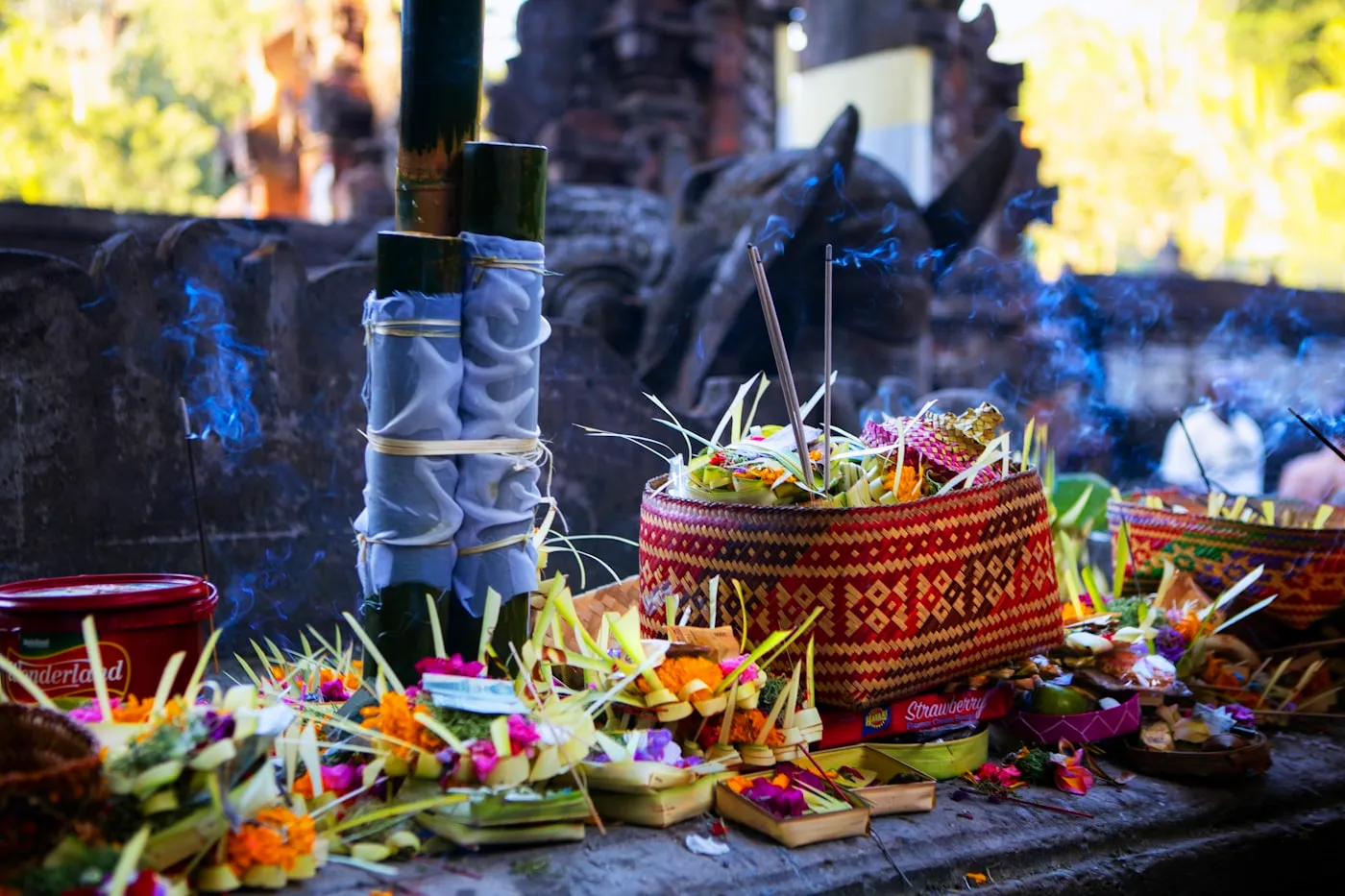 Offerings and incense left at a Balinese shrine